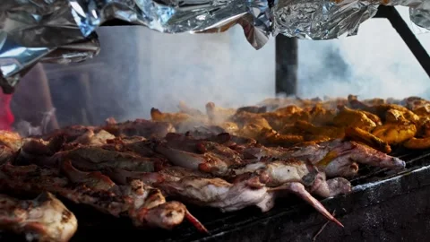 Fried meat on the grill with smoke Stock Footage 285943231