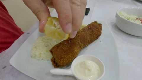 Fried meat with lemon juice Stock Footage 140514980