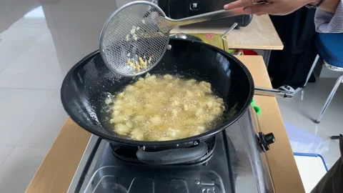 Fried meat or flour in a pan. boiling oil Stock Footage 227697581
