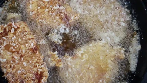 Fried meat in a pan Stock Footage 72973032
