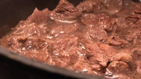 Fried meat in a pan Stock Footage 87138436