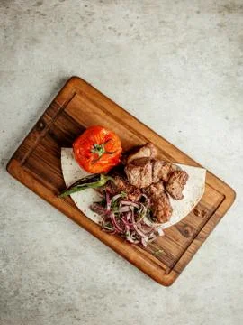 Fried meat pieces with vegetables Stock Photos