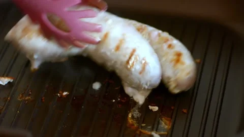Fried meat pork and beef sausages in a grill pan. Stock Footage 130800964
