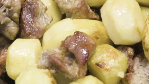Fried meat with potatoes in the process of cooking. Meat is stewed with potatoes Stock Footage 205412255