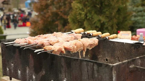Fried meat on a skewer Видео 61574852