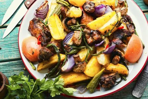 Fried meat with vegetables Stock Photos