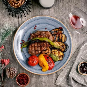 Fried meat with vegetables top view Stock Photos