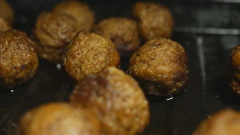 Fried meatballs on a metal baking sheet. Filming Dolly. Stock Footage 154476677