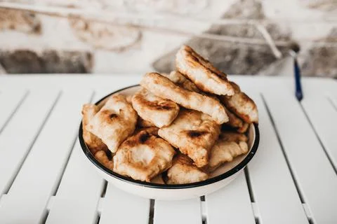 Fried mini bread in a plate. Balkan lunch Stock Photos