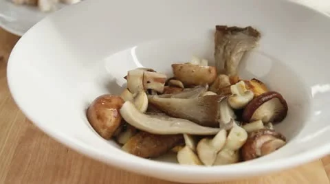 Fried mushroom being removed from the pan Stock Footage 24652009