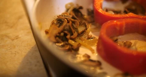 Fried mushrooms and paprika baking and mixing Video stock 88047341