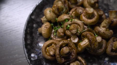 Fried mushrooms on a platter, decorated with micro greens. Close-up. Stock Footage 248155145