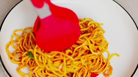 Fried noodles served on a white plate Stock Footage 329830897
