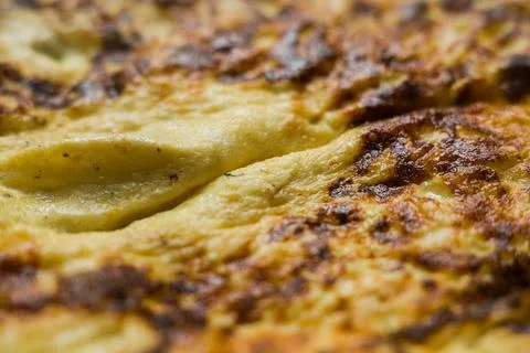 Fried omelet close-up on the kitchen table Stock Photos