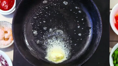 Fried onions in a pan on top, a kitchen, a wooden spatula Stock Footage 67552322