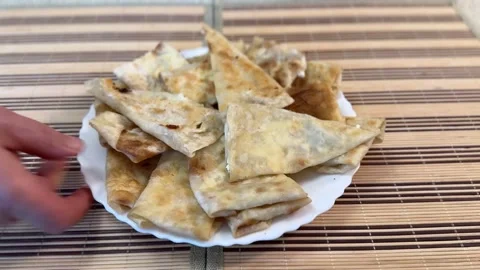 Fried pancakes envelopes with cottage cheese, in the form of envelopes on a Stock Footage 270413048