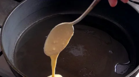 Fried pancakes in a frying pan Stock Footage 59615059