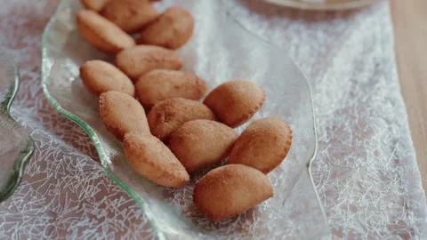 Fried Pastries on Glass Leaf Plate with Lace Cloth Stock Footage 343697406