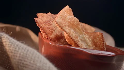 Fried pastry of different flavors in a clay container Stock Footage 130628604