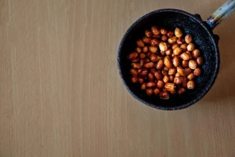 Fried Pea nuts in a small pan Stock Photos