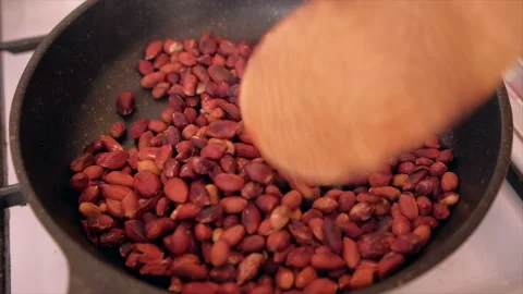 Fried peanuts in frying pan. Stock Footage 168983685