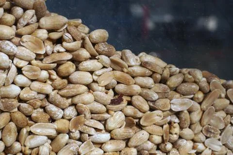 Fried peanuts in the window of the shop Stock Photos
