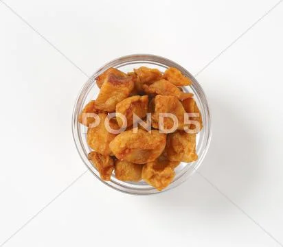 Fried pieces of pork rind and fat Stock Photos