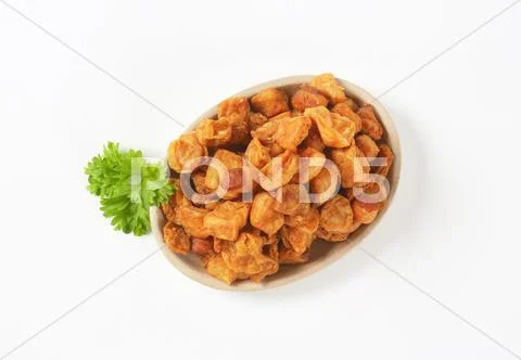 Fried pieces of pork rind and fat Stock Photos