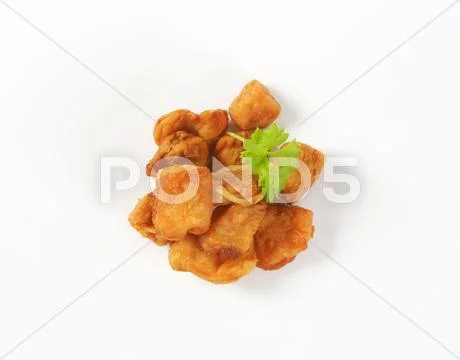 Fried pieces of pork rind and fat Stock Photos