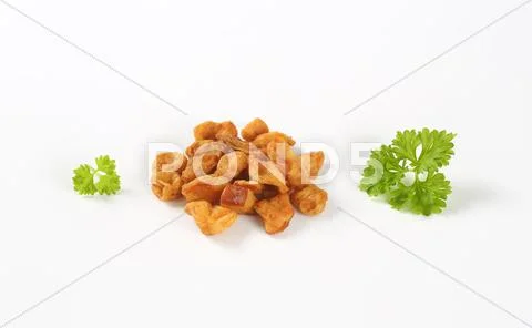 Fried pieces of pork rind and fat Stock Photos