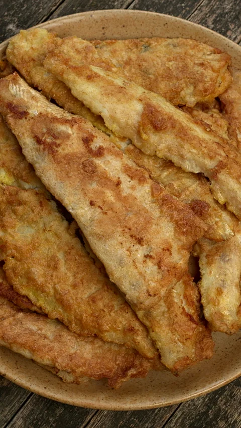 Fried pike-perch fillets. Vertical video. Stock Footage 296915479