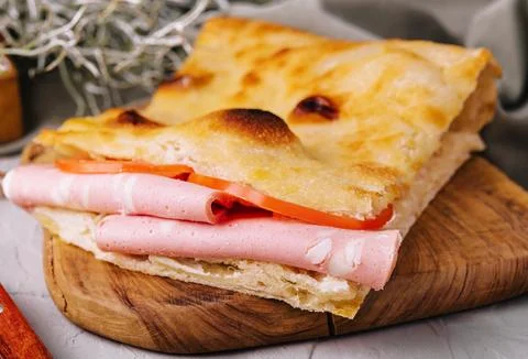 Fried pita bread with ham close up Stock Photos