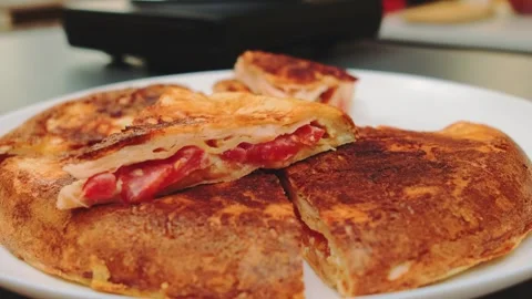Fried pita bread stuffed with tomatoes and sausage Stock Footage 249356125