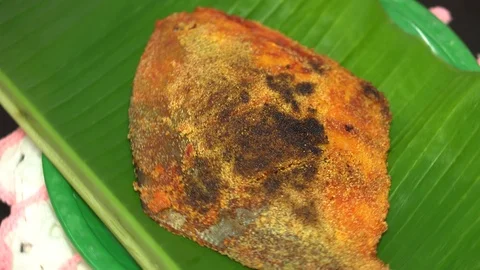 Fried Pomfret Fish Rotating on Turntable 4K Video stock 120725559