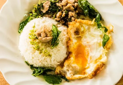Fried pork with basil egg and rice, Thai food Stock Photos