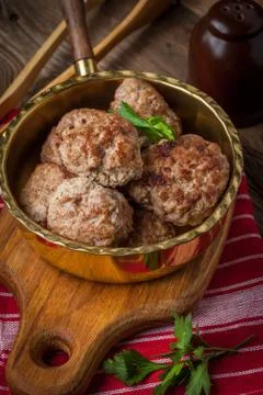 Fried pork chops in the pan. Stock Photos