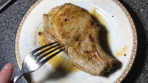 Fried pork steak on the bone Stock-Footage 106575147