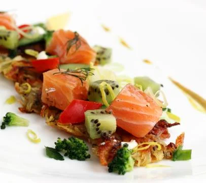 Fried potato cakes with smoked salmon Stock Photos