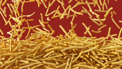 Fried potato chips falling down from above and filling the screen Видео 98637264