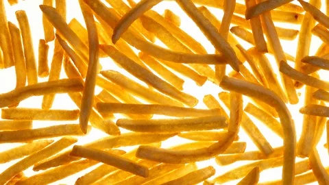 Fried potato chips rotating on white background in 4K. 動画素材 87156482