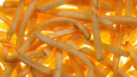 Fried potato chips rotating on white background in 4K. 스톡 동영상 89891682