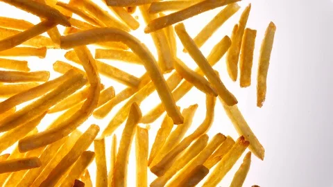 Fried potato chips rotating on white background in 4K with free place for text Vídeo Stock 89891717