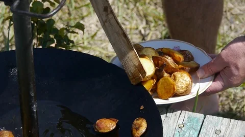 Fried potato man put it on plate 스톡 동영상 113998775