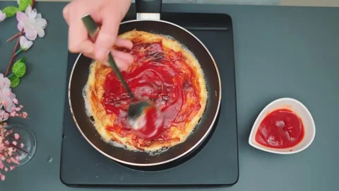 Fried potato pancake spread with ketchup Stock-Footage 249079565