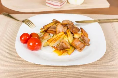 . fried potatoes with bacon Stock Photos