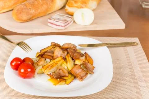 . fried potatoes with bacon Stock Photos