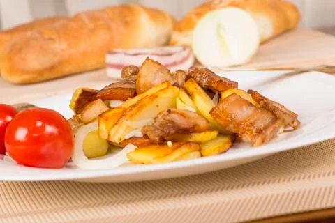 . fried potatoes with bacon Stock Photos