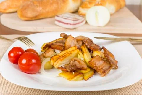 . fried potatoes with bacon Stock Photos