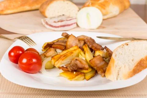. fried potatoes with bacon Stock Photos