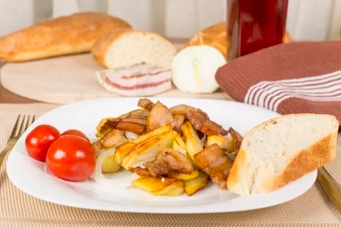 . fried potatoes with bacon Stock Photos